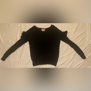 Black sweater with ruffle on shoulders